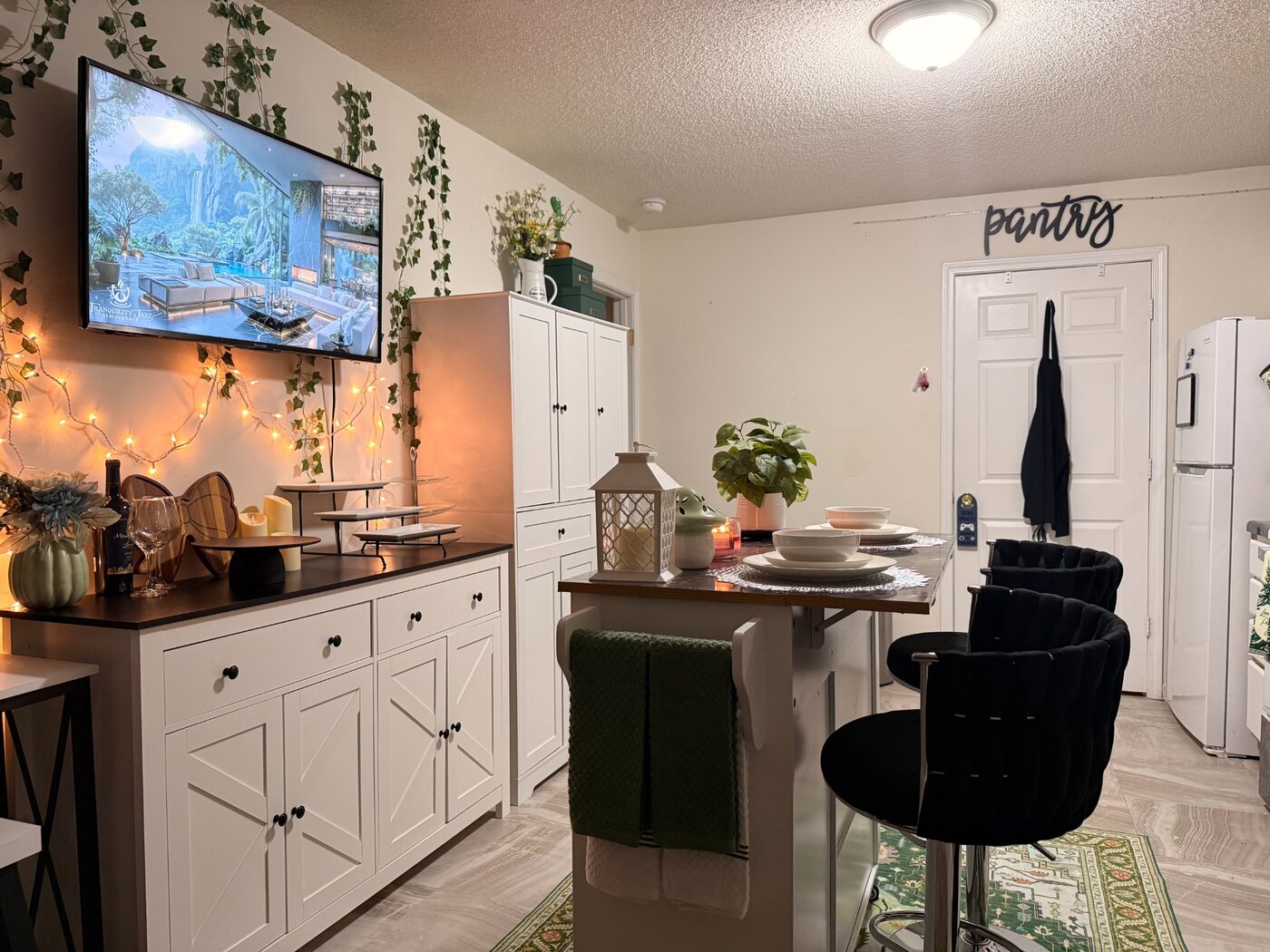 Clean and carefully styled kitchen and dining area by Versaux